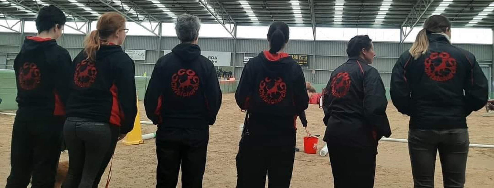 Canterbury Canine Obedience Club members in team jackets